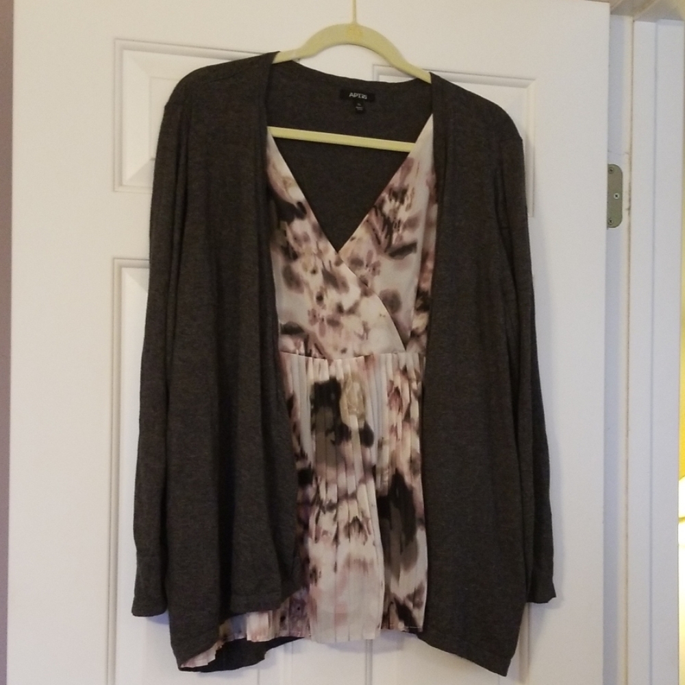 Sweater and sheer blouse underneath all one piece